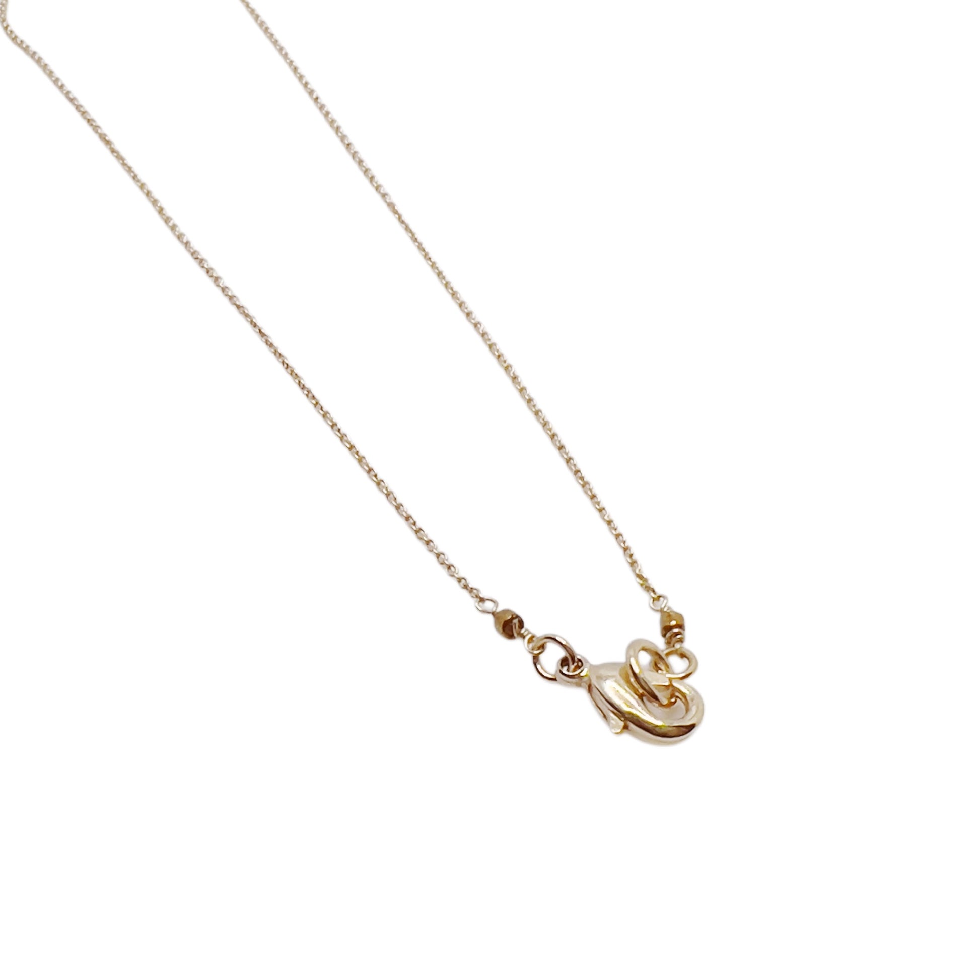 【Helena Rohner】tiny ceramic egg gold plated brass pendant_ecru